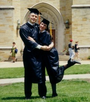 Me and my husband at college graduation (two weeks before being married)