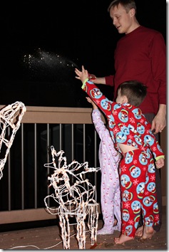 tossing the reindeer food in the yard